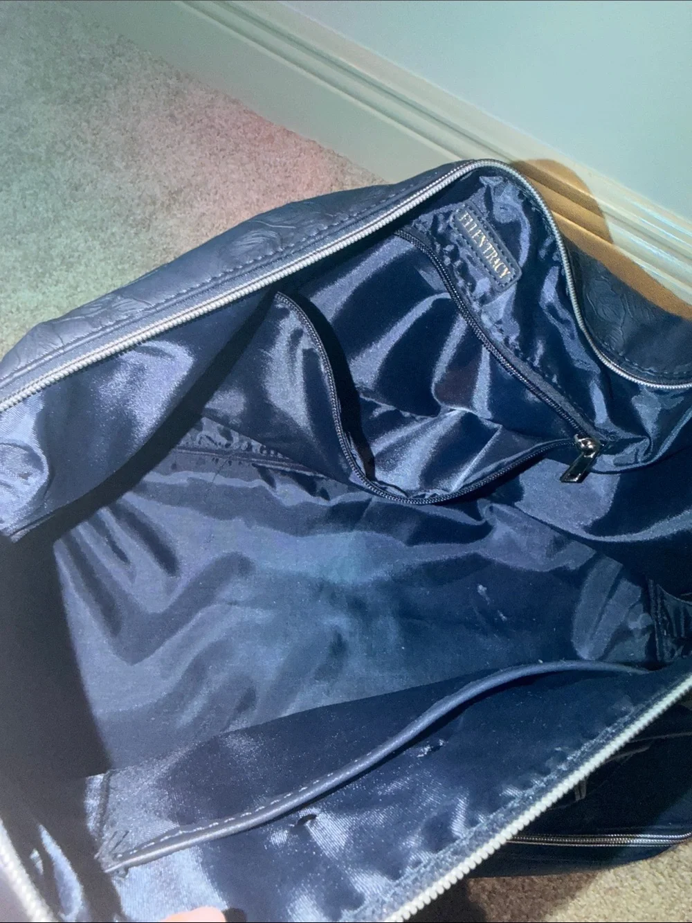 Ellen Tracy Navy Floral-Embossed overnight bag.